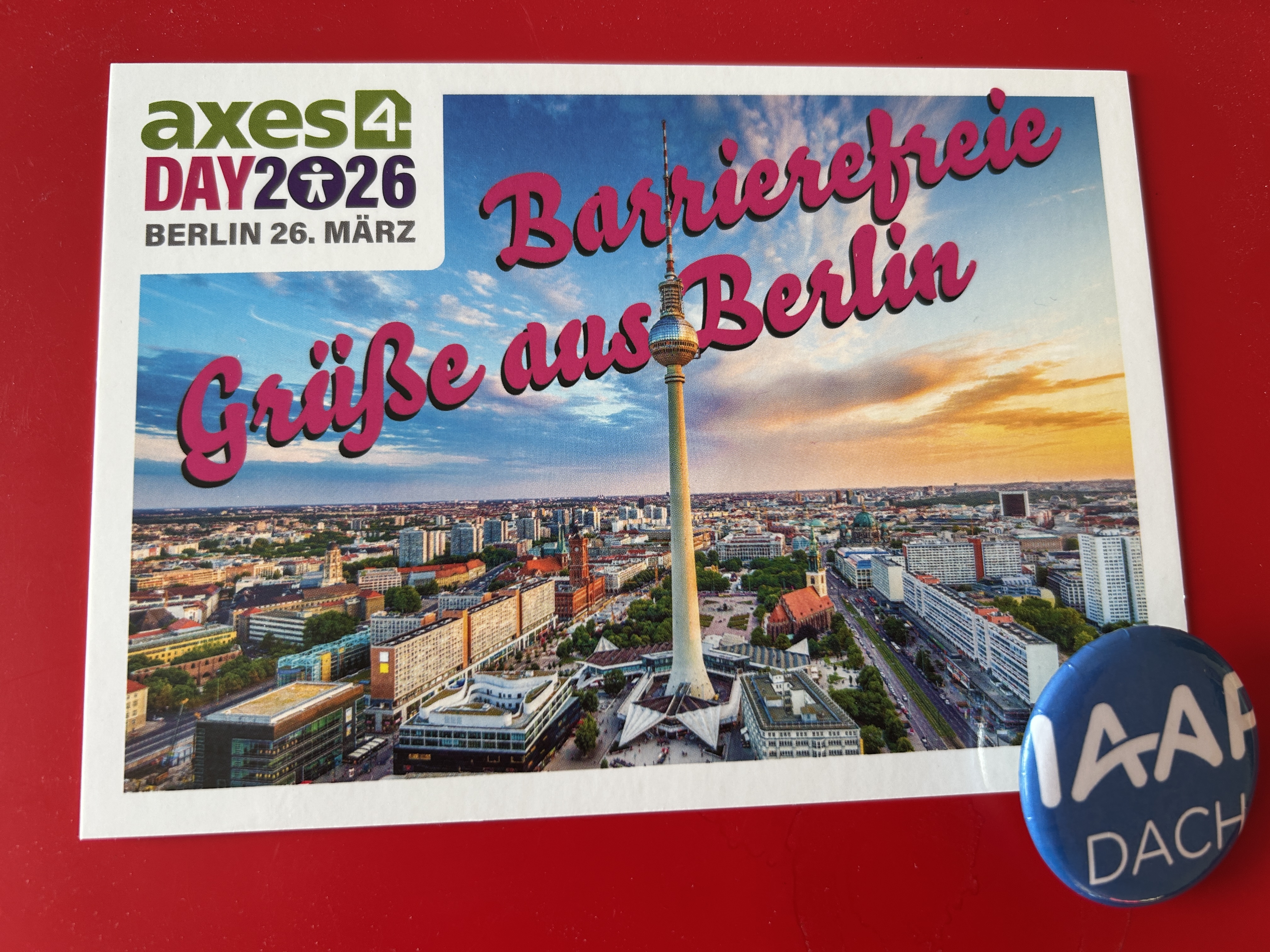 Text: axes4Day 2026 Berlin 26. März- Barierefreie Grüße aus Berlin, Hintergrund Stadtansicht Berlin mit Fernsehturm, kleiner Button mit Logo IAAP D-A-CH